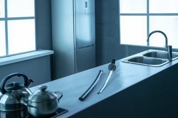 Samurai sword lies on the kitchen table