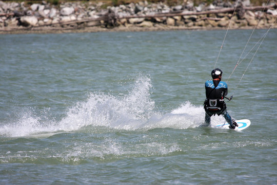 kitesurfer riding his board