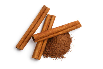 Cinnamon sticks and powder, isolated on white background, view from above