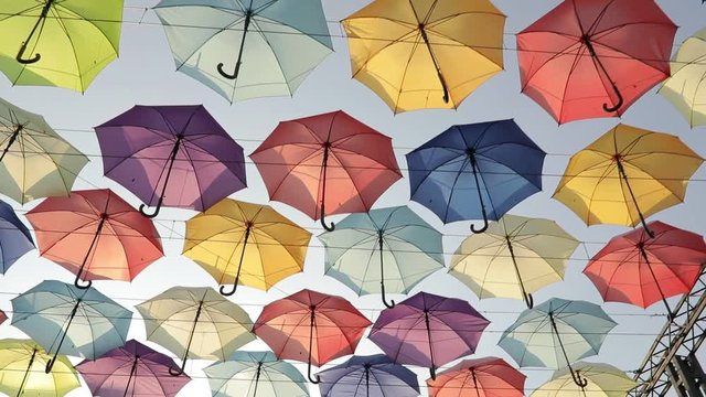 Many colorful umbrellas hanging