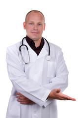 Fototapeta premium Young adult doctor in white lab coat and stethoscope shows palm up and smiles against white background