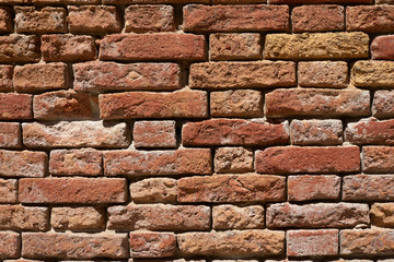 Ancient red brick wall texture background, sunlight