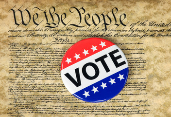 close up of campaign vote button on the United States Constitution document