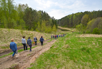KALININGRAD REGION, RUSSIA. Tourists go down to the valley of the river Blue