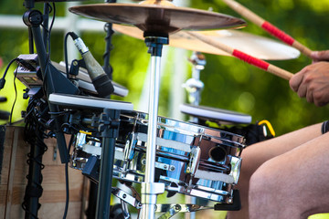 male drummer behind the drum set