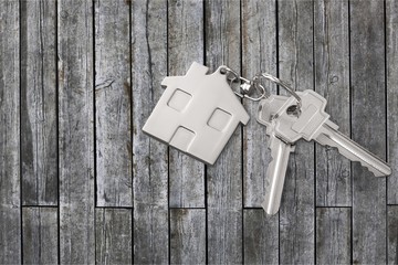 House keys on wooden floor background