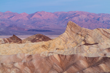 Dawn at Zabriskie Point, Death Valley, With Sun Warming the Distant Mountains