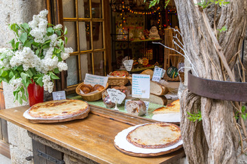 Galettes Pastries for Sale in a Cafe Window, Perouges, France