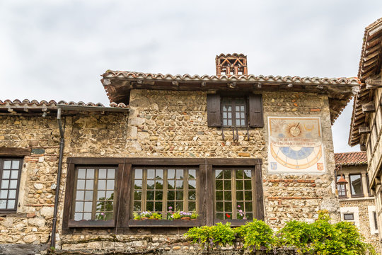 Medieval Stone Building with Leaded Glass Window Panes on the Main Square in Perouges, France