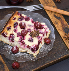  cheesecake with cherries on a glass plate