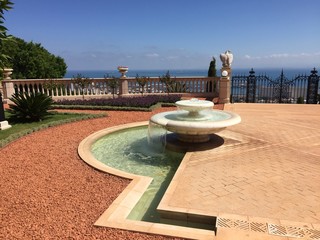 Beautiful Bahai gardens and temple on the slopes of the mount Carmel and view of the Mediterranian sea in Haifa city, Israel.