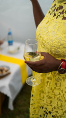 African-american woman holding a glass of wine