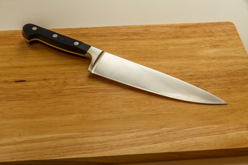 Cook’s knife on chopping board