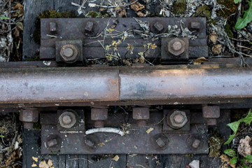 Fototapeta na wymiar Old railway rails. Connecting railway rails in old technology.