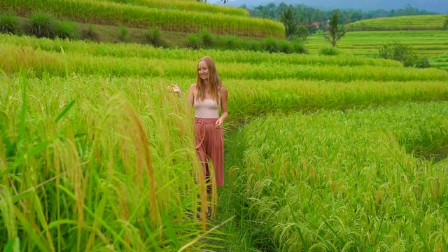 Young woman visiting the Jatiluwih Rice Terraces on the Bali Island