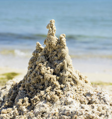 sand castle on the beach on a summer sunny day