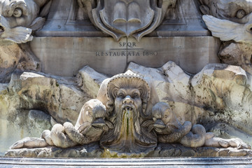 Fototapeta na wymiar Details from a fountain in Piazza dell Popolo, Rome