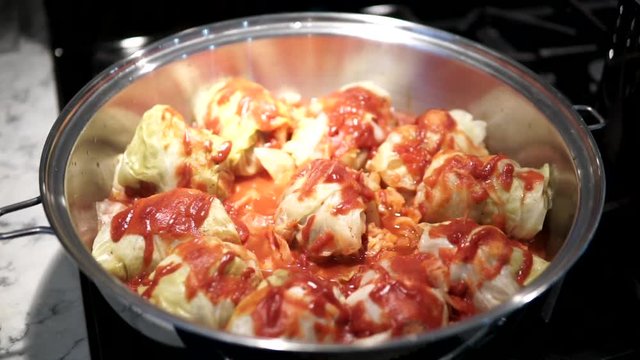 Hawaiian Stuffed Cabbage is a staple dish prepared by many in Hawaii. Each roll is infused with beef and occasionally Kalua or roast pork, and topped with a rich flavorful homemade tomato sauce.