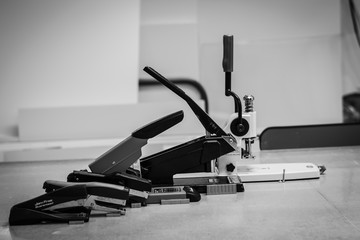 Variety of staplers and staples at a print shop