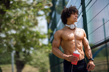 Young handsome man exercising outdoor.