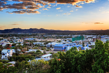 Fototapeta na wymiar Sunset over Windhoek city panorama with mountains in the backgro