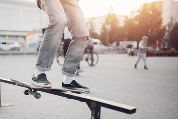 Fototapeta na wymiar Male skateboarder performs tricks on ramp on skateboard. Concept street sports, bully