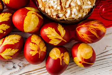 painted eggs with traditional Easter bread on the table