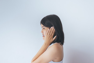 Obraz premium Asian woman hands touching her ears,Tinnitus
