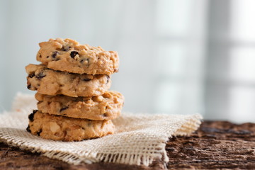Pile of chocolate chip cookies on sackcloth.