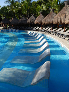 Pool amenities at a tropical resort in Cancun, Mexico