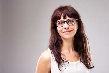 Smiling friendly woman wearing glasses