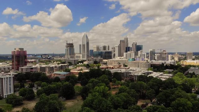 A Drone shot of the Charlotte, North Carolina skyline at mid day.