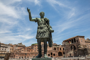 Looking up at the statue of Julius Caesar in Via dei Fori Imperiali, Rome - obrazy, fototapety, plakaty
