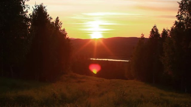 Sunset at a Lake Looking Through The Bugs Flying By