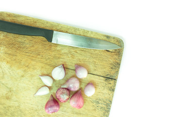 red onion sliced on wooden cutting board