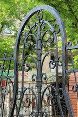 Fragment of forged fence with tracery ornaments