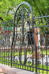 Fragment of forged fence with tracery ornaments