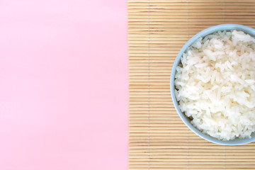 rice in bowl on pink background rose quartz