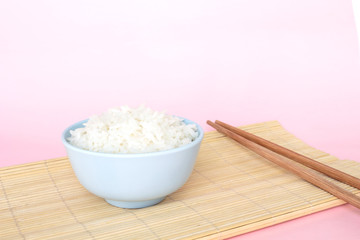 rice in bowl on pink background rose quartz