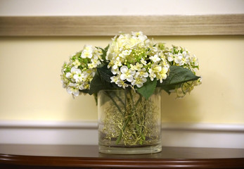 close up on artificial flower in vase on the table