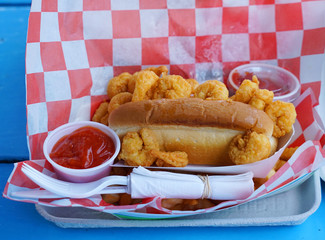 close up on fast seafood with hot dog and fried shrimp