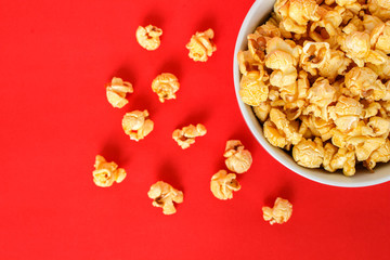 popcorn white bowl on red background