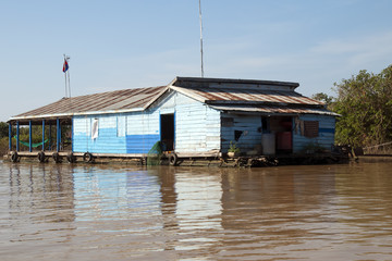 Fototapeta na wymiar Tonle Sap Lake Siem Reap Cambodia, traditional houseboat on tributary 