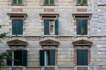 Ornate shuttered windows in a side street near St Peter's Cathedral, Rome, Italy