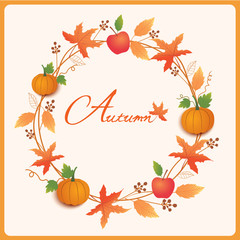 Autumn wreath with maple leaf, pumpkins and apples.