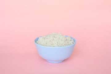 rice in bowl on pink background rose quartz