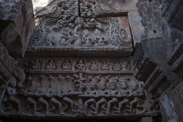 Battambang Cambodia, carved pediment depicting the hindu mythology of Churning of the Ocean of Milk at the Wat Ek Phnom a 11th century angkorian temple