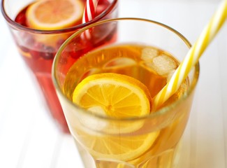 Fresh cold summer drinks close-up view. Green ice tea and cranberries drink.