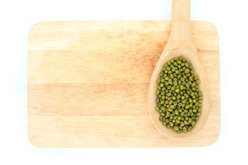 mung bean green in spoon texture on wood background
