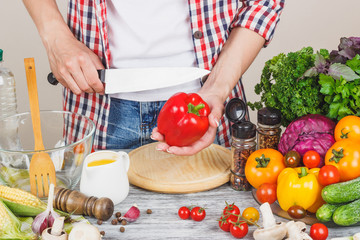 Woman cooks at the kitchen